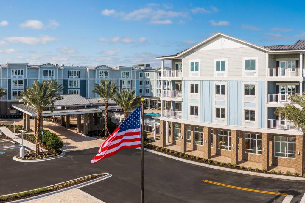 an american flag in front of a building at Courtyard Amelia Island in Amelia Island