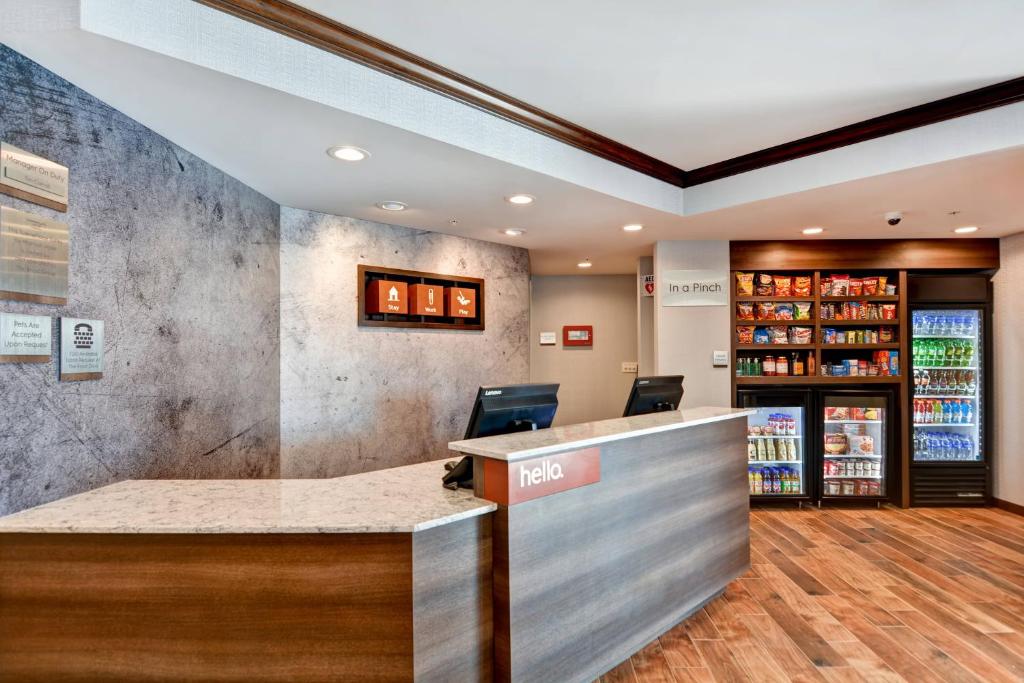 a lobby of a store with a reception counter at TownePlace Suites by Marriott Bridgewater Branchburg in Branchburg Park