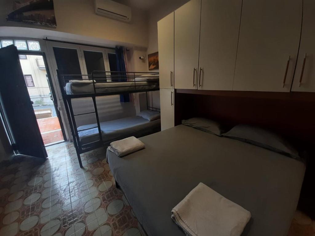 a bedroom with a bed and a bunk bed at Tourist Rental Home ROMA in Rome