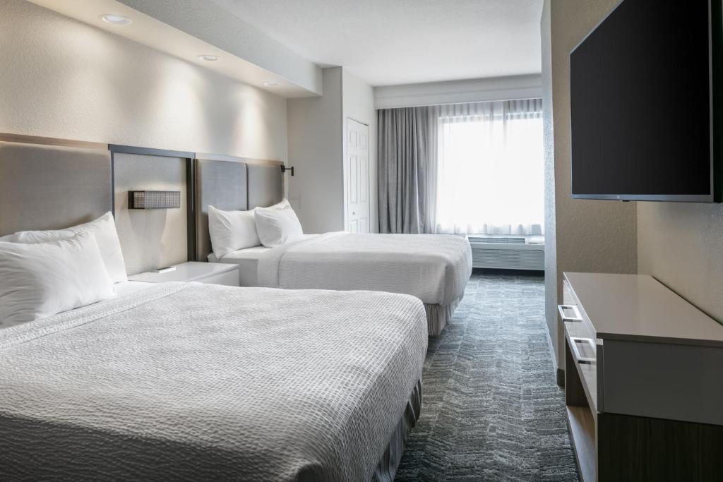 Postel nebo postele na pokoji v ubytování SpringHill Suites by Marriott Cheyenne