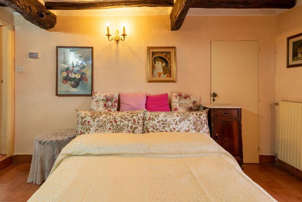 Postel nebo postele na pokoji v ubytování Casa Vacanza Lucignano