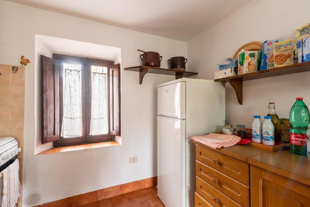 Kuchyň nebo kuchyňský kout v ubytování Casa Vacanza Lucignano