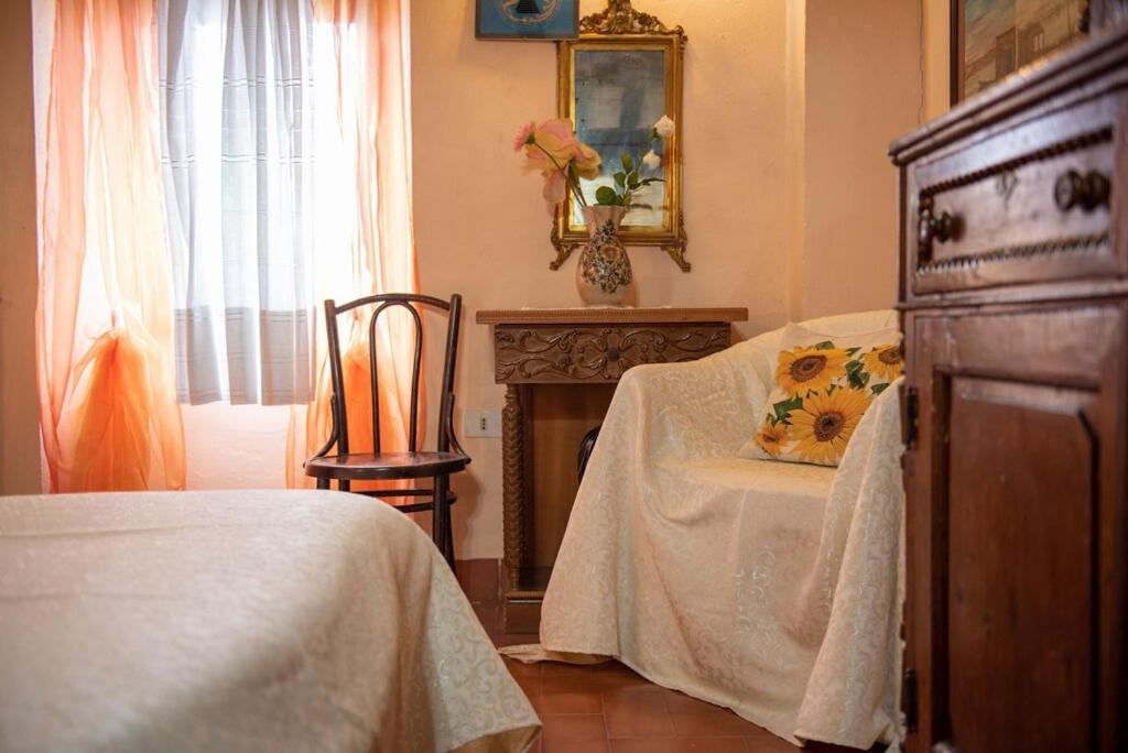 Postel nebo postele na pokoji v ubytování Casa Vacanza Lucignano