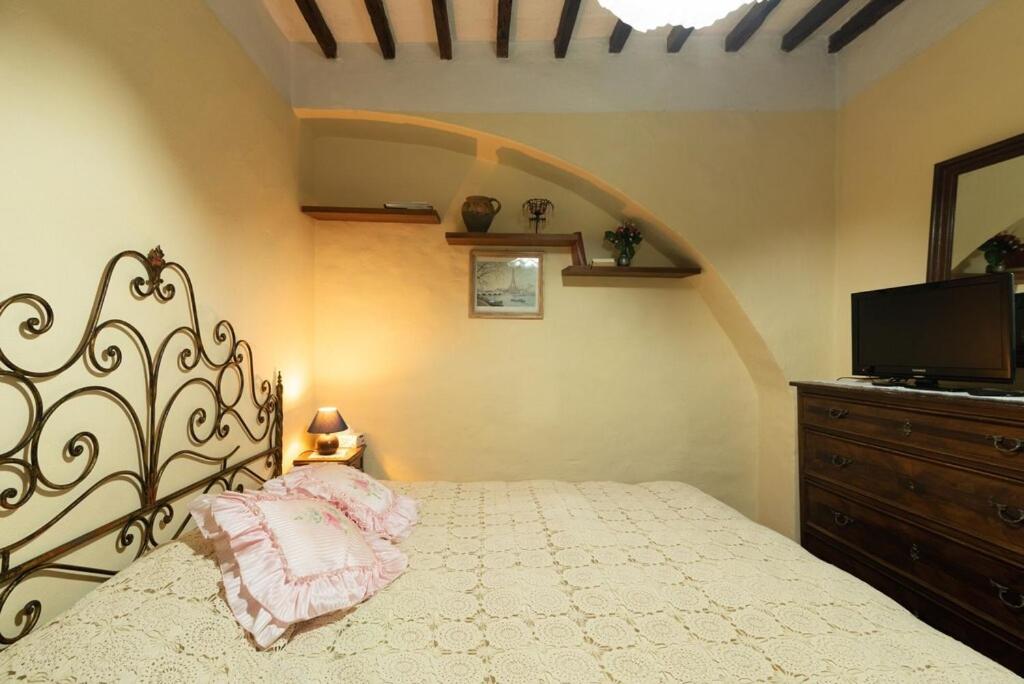 Postel nebo postele na pokoji v ubytování Casa Vacanza Lucignano