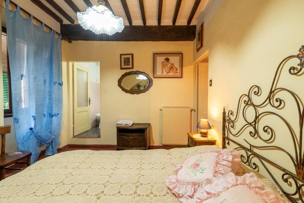 Postel nebo postele na pokoji v ubytování Casa Vacanza Lucignano