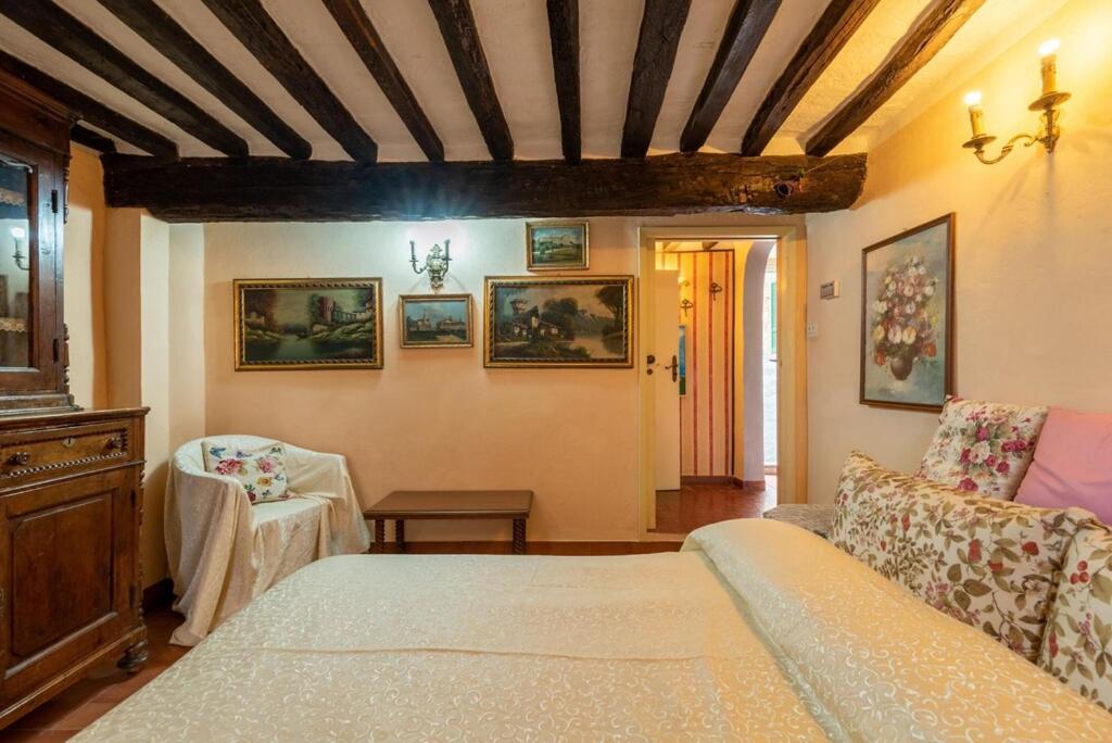 Postel nebo postele na pokoji v ubytování Casa Vacanza Lucignano