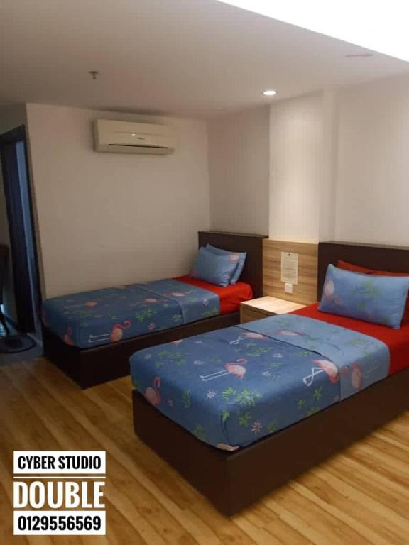 Postel nebo postele na pokoji v ubytování Cyber Studio Apartment