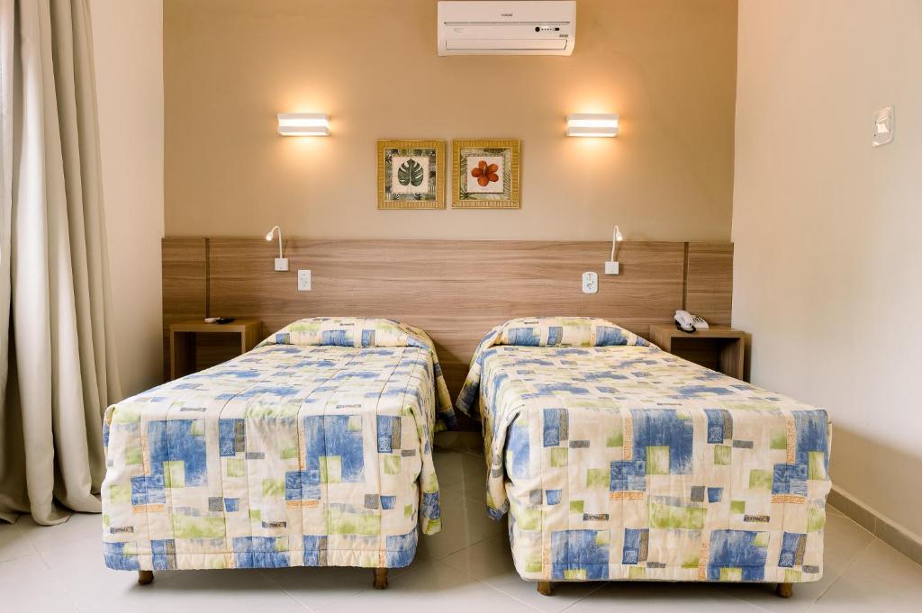 Cama ou camas em um quarto em Guararema Parque Hotel