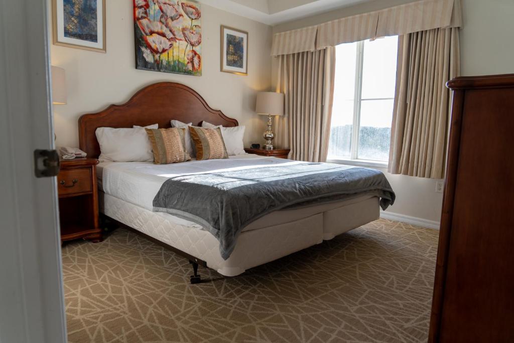 a bedroom with a bed and a large window at The Point Hotel & Suites - 705S Luxury - Pool view - Close to Universal in Orlando
