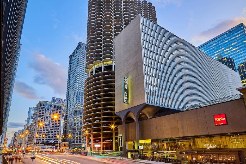 a large building in a city with tall buildings at Hotel Chicago Downtown, Autograph Collection in Chicago