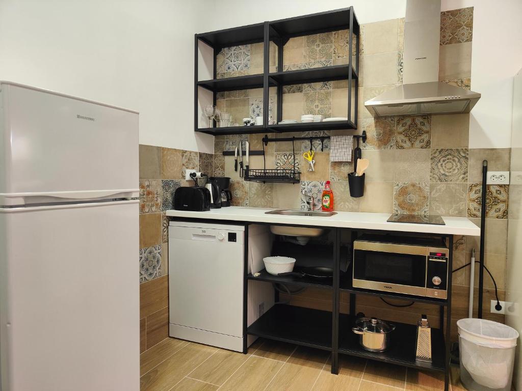 Kuchyň nebo kuchyňský kout v ubytování Apartamentos Pueblo Mar
