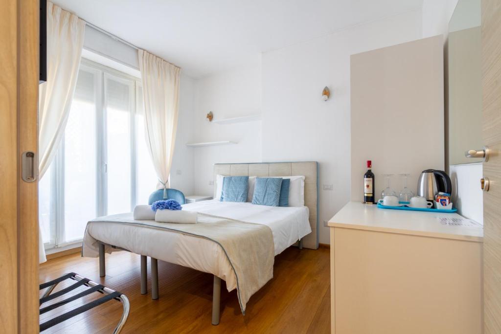 A bed or beds in a room at B&B Home Flowers Milano