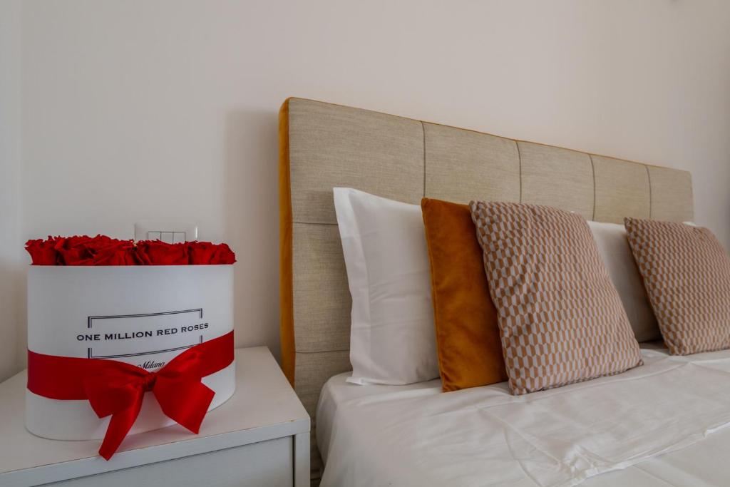 A bed or beds in a room at B&B Home Flowers Milano
