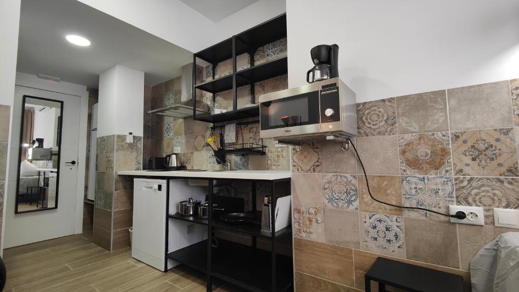 Kuchyň nebo kuchyňský kout v ubytování Apartamentos Pueblo Mar