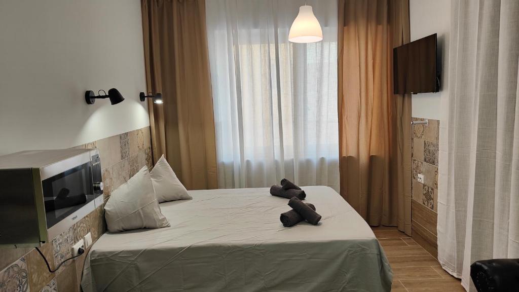 Postel nebo postele na pokoji v ubytování Apartamentos Pueblo Mar