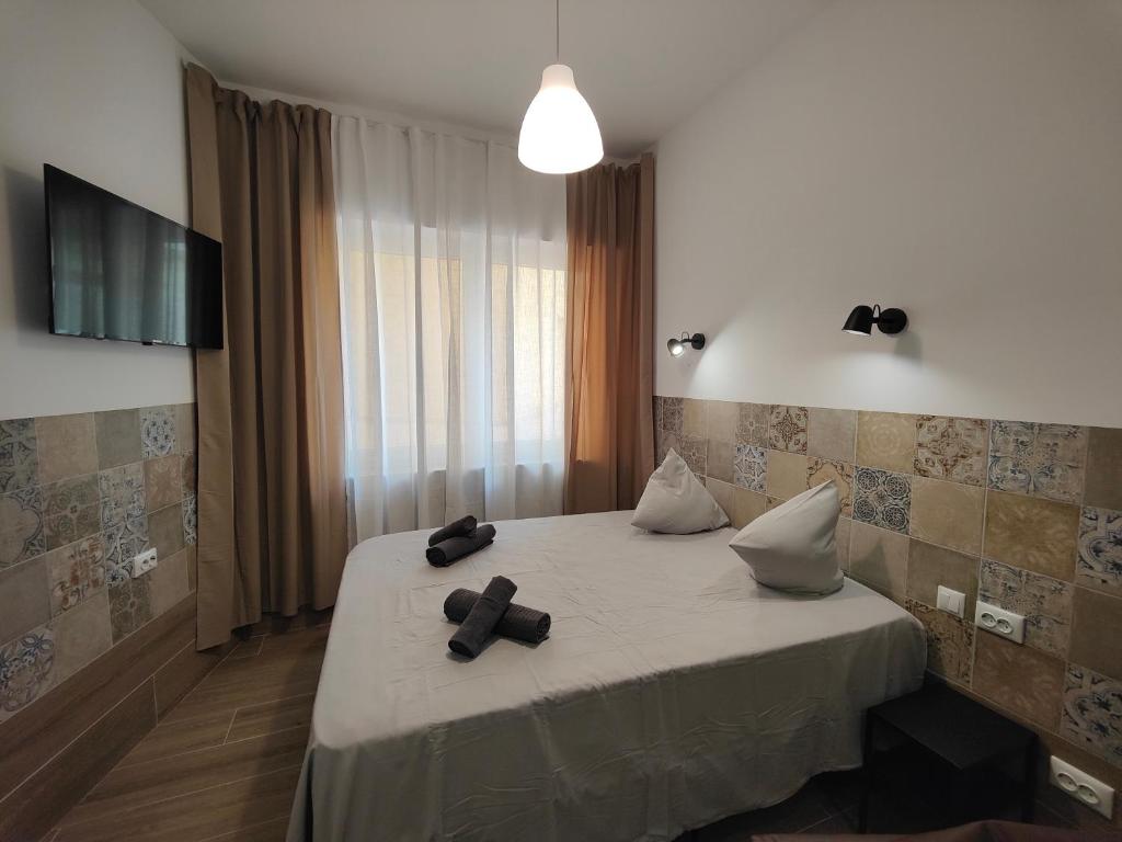 a hotel room with a bed with two pillows on it at Apartamentos Pueblo Mar in Calpe