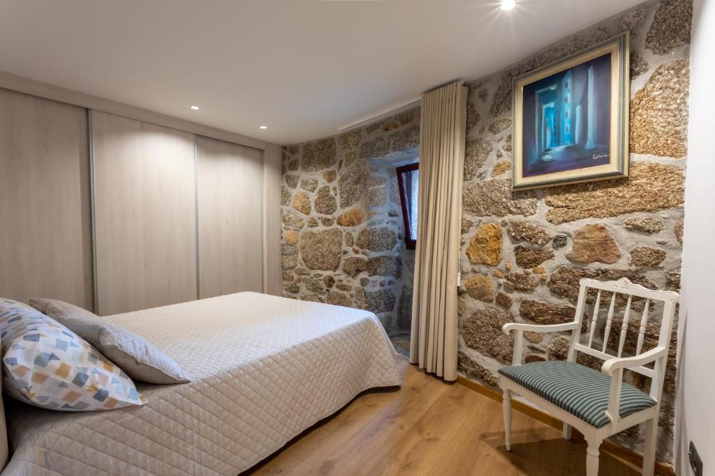Postel nebo postele na pokoji v ubytování Carvalho Village