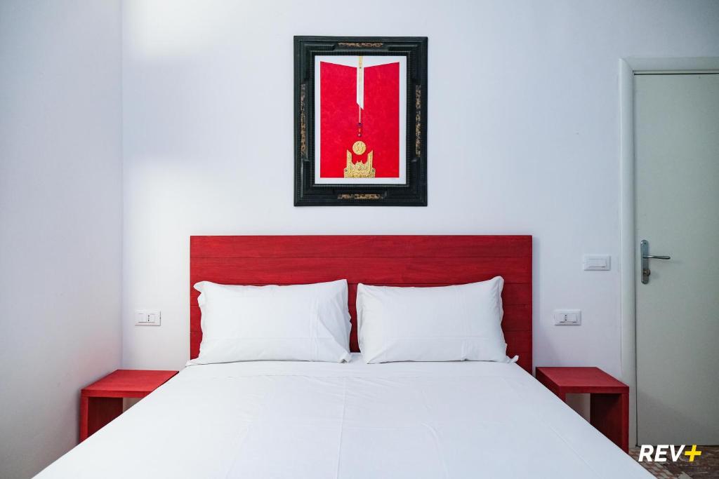 Postel nebo postele na pokoji v ubytování Lia Art Hotel