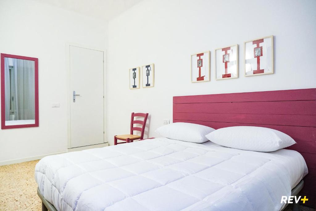Postel nebo postele na pokoji v ubytování Lia Art Hotel