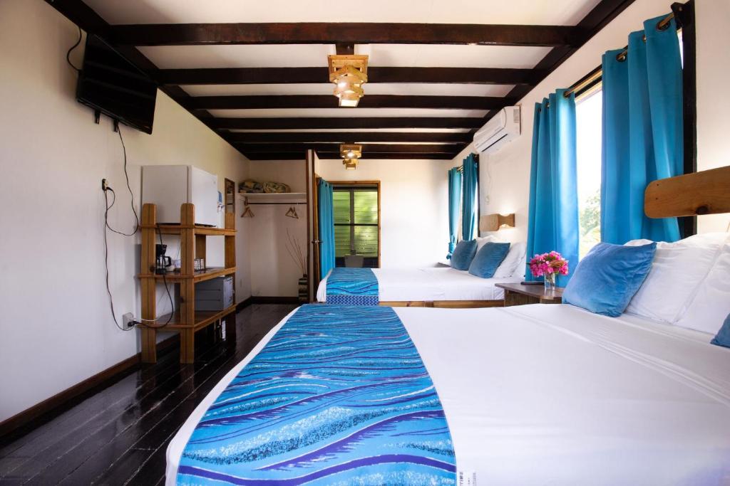 Postel nebo postele na pokoji v ubytování Mango Inn Resort