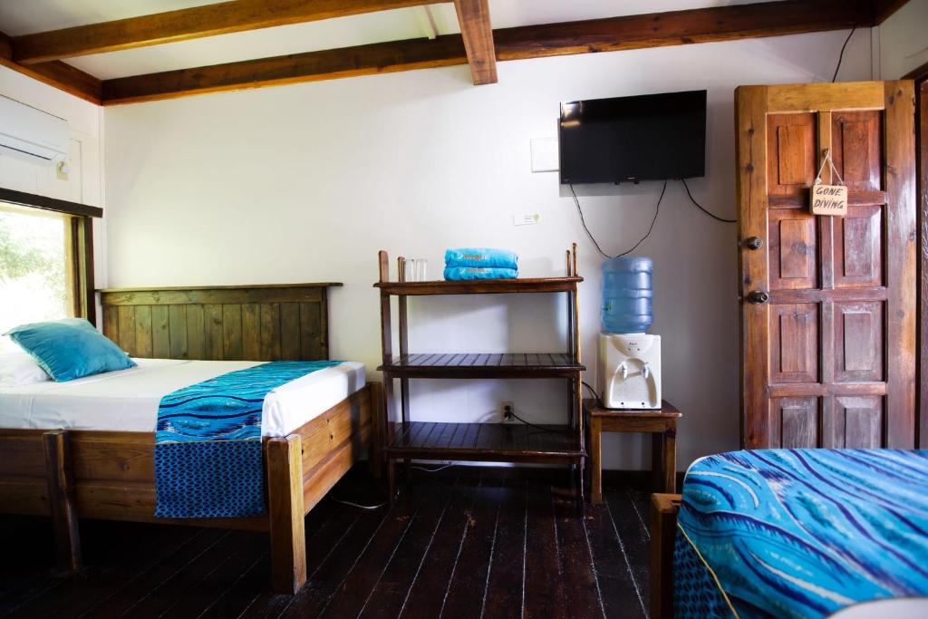 Postel nebo postele na pokoji v ubytování Mango Inn Resort