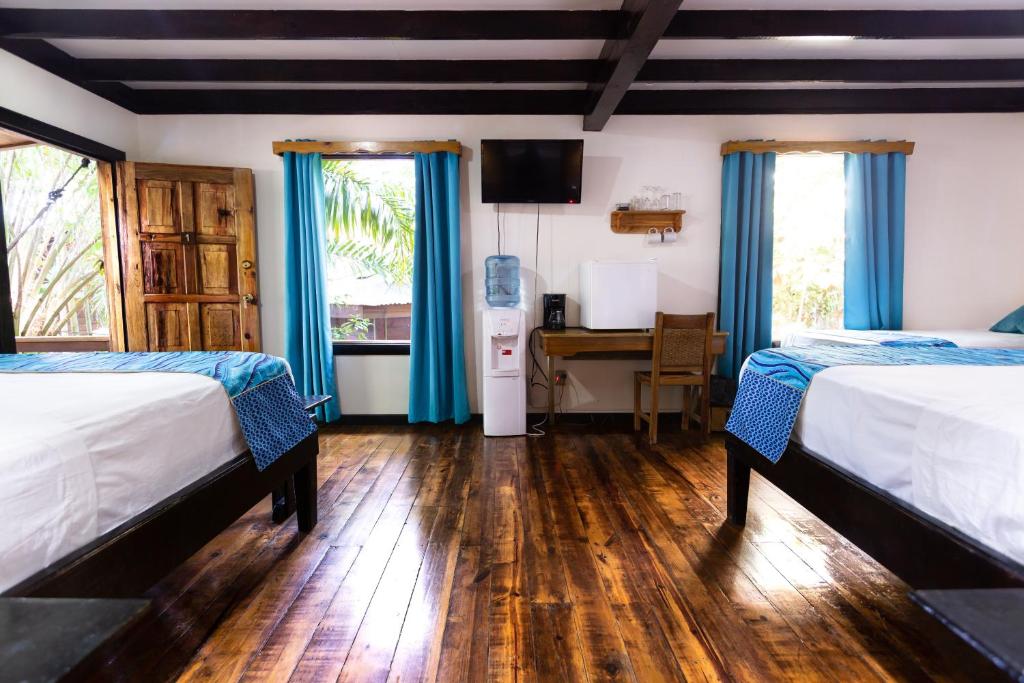 Postel nebo postele na pokoji v ubytování Mango Inn Resort
