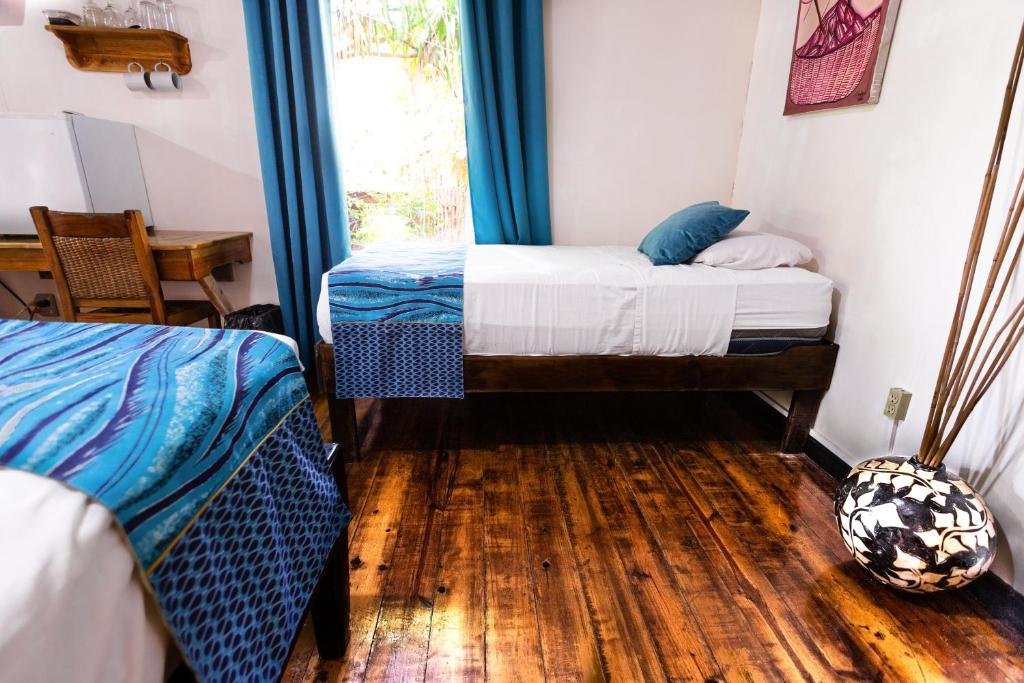 Postel nebo postele na pokoji v ubytování Mango Inn Resort