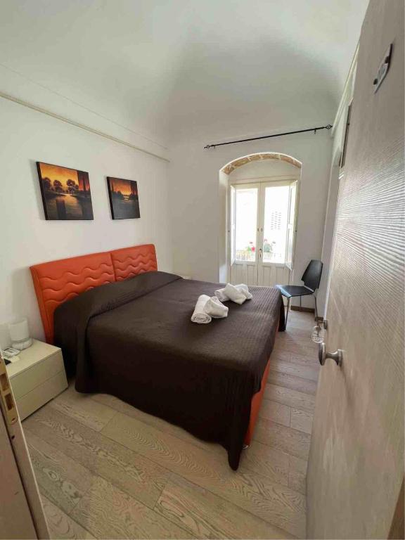 Postel nebo postele na pokoji v ubytování Plaza Rooms