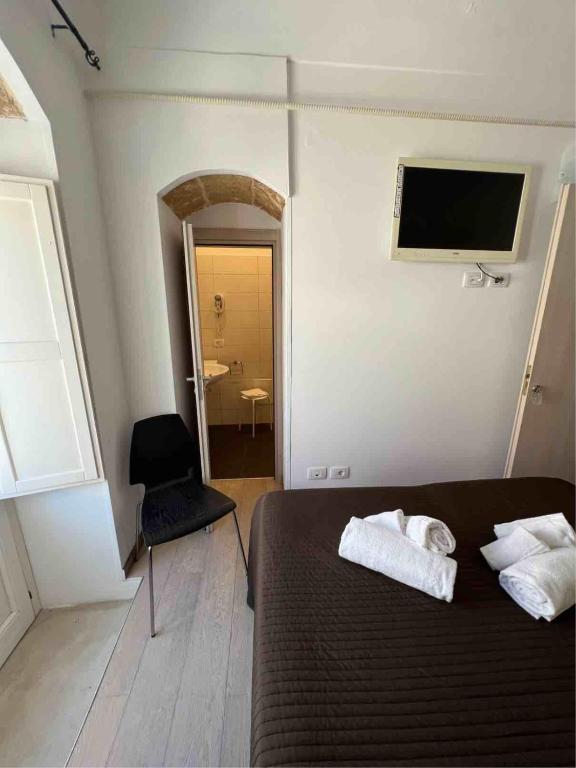 Postel nebo postele na pokoji v ubytování Plaza Rooms