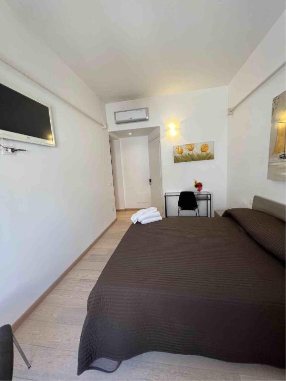 Postel nebo postele na pokoji v ubytování Plaza Rooms