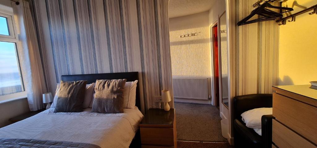 a hotel room with a bed with a window at Ocean Bay in Blackpool