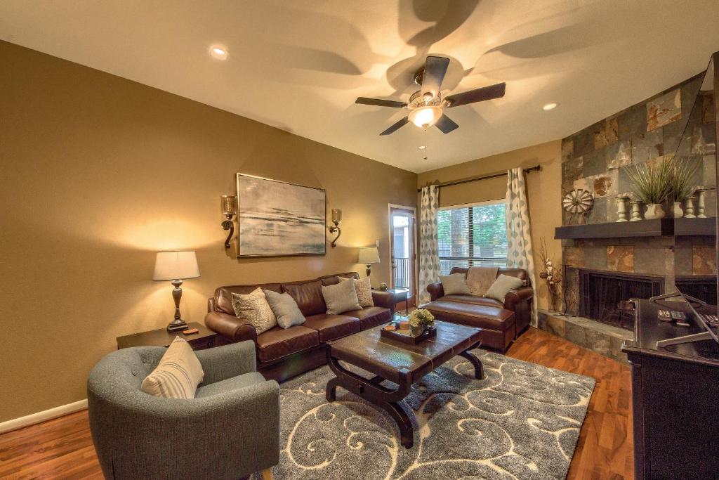 a living room with a couch and a fireplace at CW B203 Tubers Delight in New Braunfels