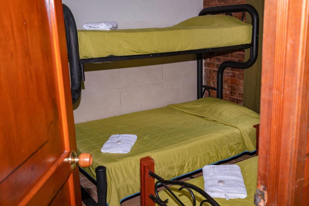 Cama o camas de una habitación en Ecovilla Cali
