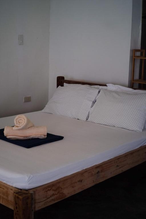 Postel nebo postele na pokoji v ubytování YAMA APARTMENTS - Private Beachfront