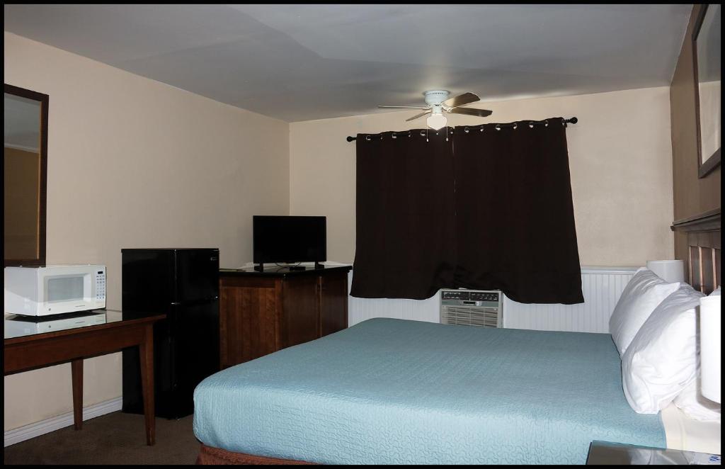 Postel nebo postele na pokoji v ubytování Antler Motel
