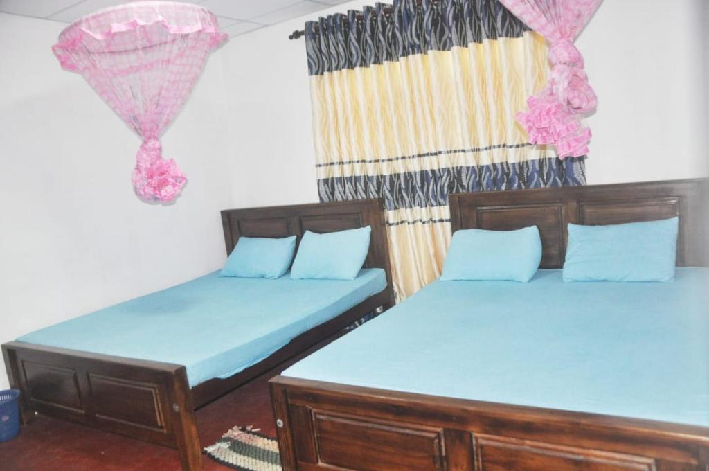 Postel nebo postele na pokoji v ubytování Impress Holiday Home