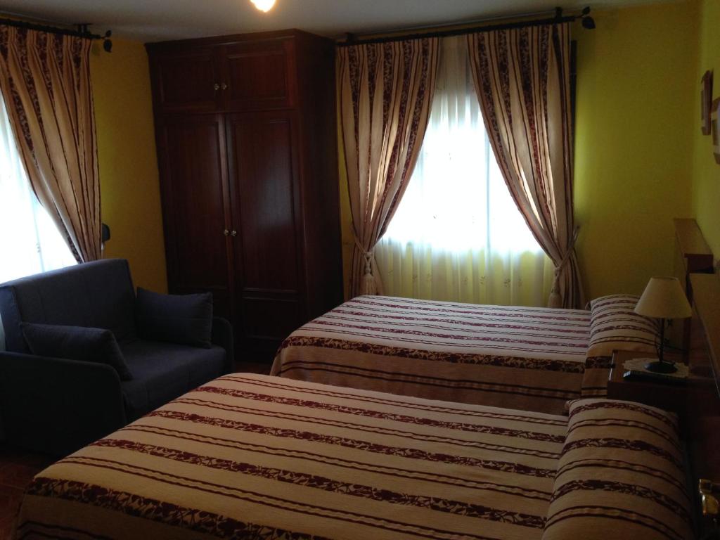 Postel nebo postele na pokoji v ubytování Hostal La Plaza