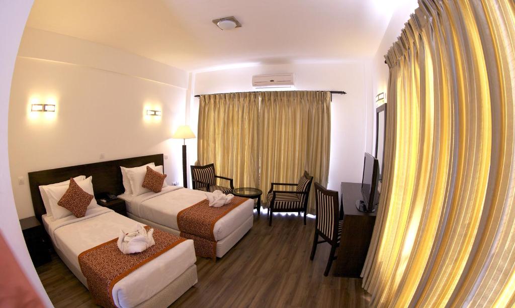 Katil atau katil-katil dalam bilik di Waterfront Resort by KGH Group