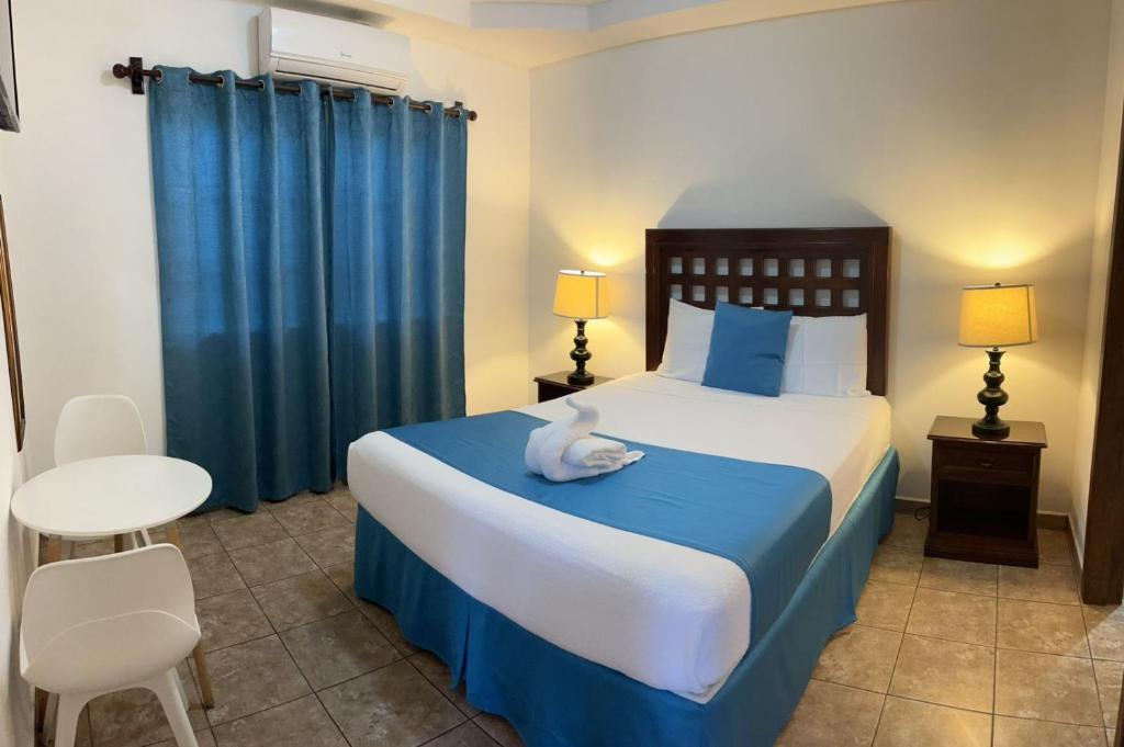 Postel nebo postele na pokoji v ubytování Hotel Playa Caribe