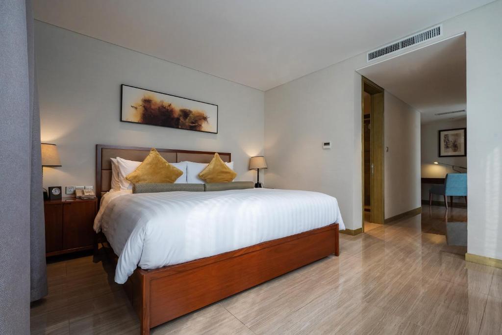 Postel nebo postele na pokoji v ubytování Oakwood Hotel & Residence Suzhou