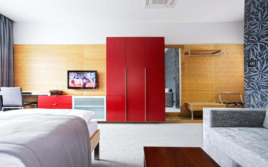 Postel nebo postele na pokoji v ubytování Wellness Hotel ABÁCIE