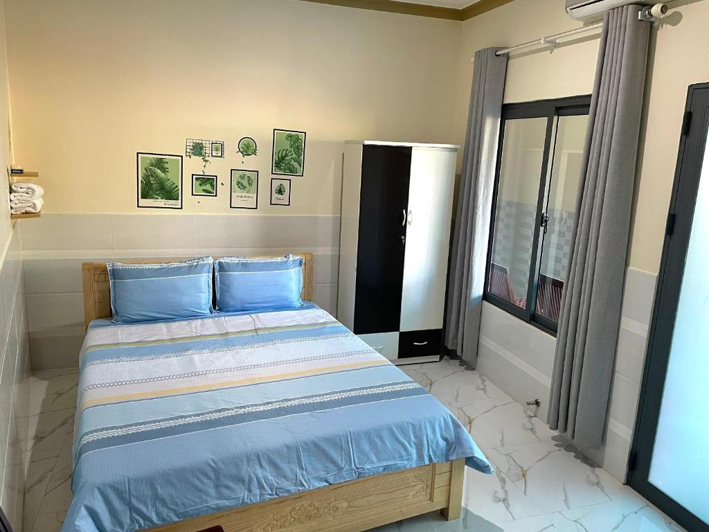 Giường trong phòng chung tại T'H Homestay