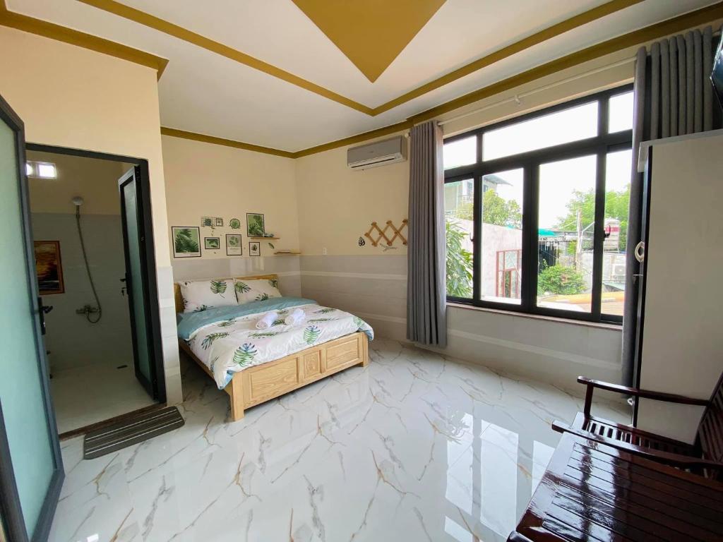 Giường trong phòng chung tại T'H Homestay