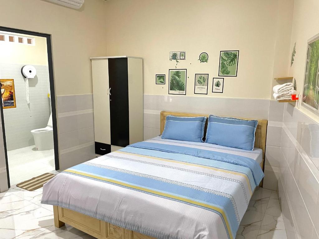 Giường trong phòng chung tại T'H Homestay
