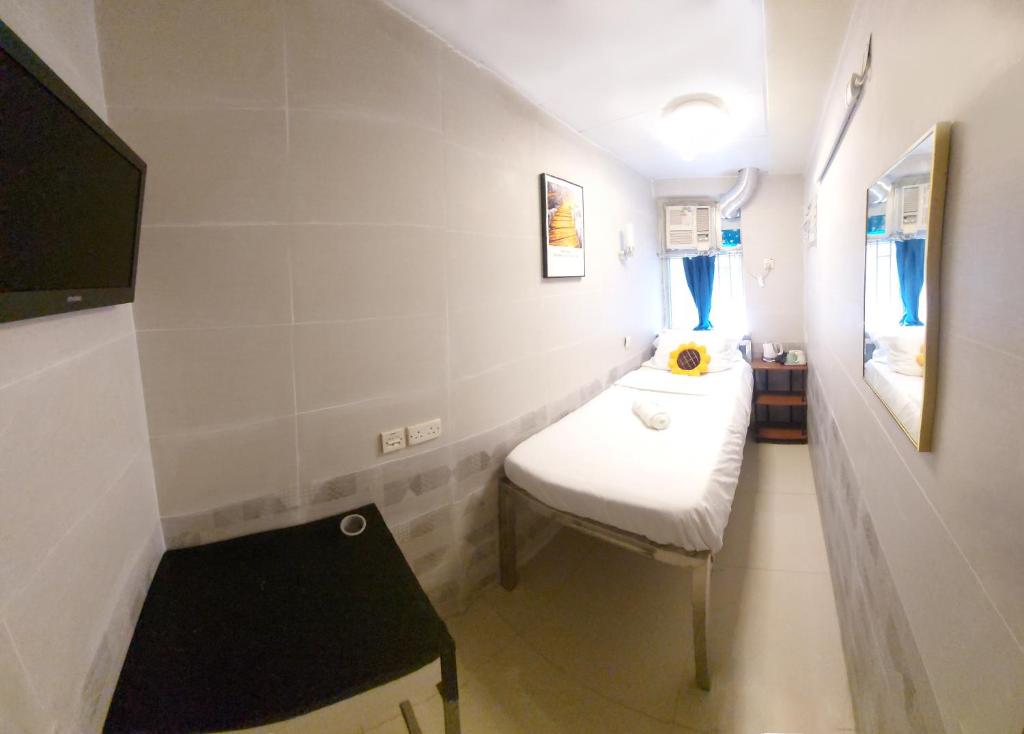 Letto o letti in una camera di Apple Hostel 蘋果賓館