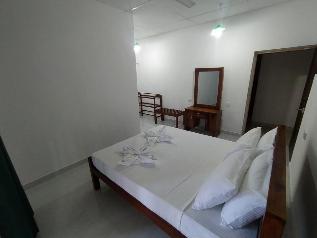 Postel nebo postele na pokoji v ubytování Water Front Home Stay and Resort