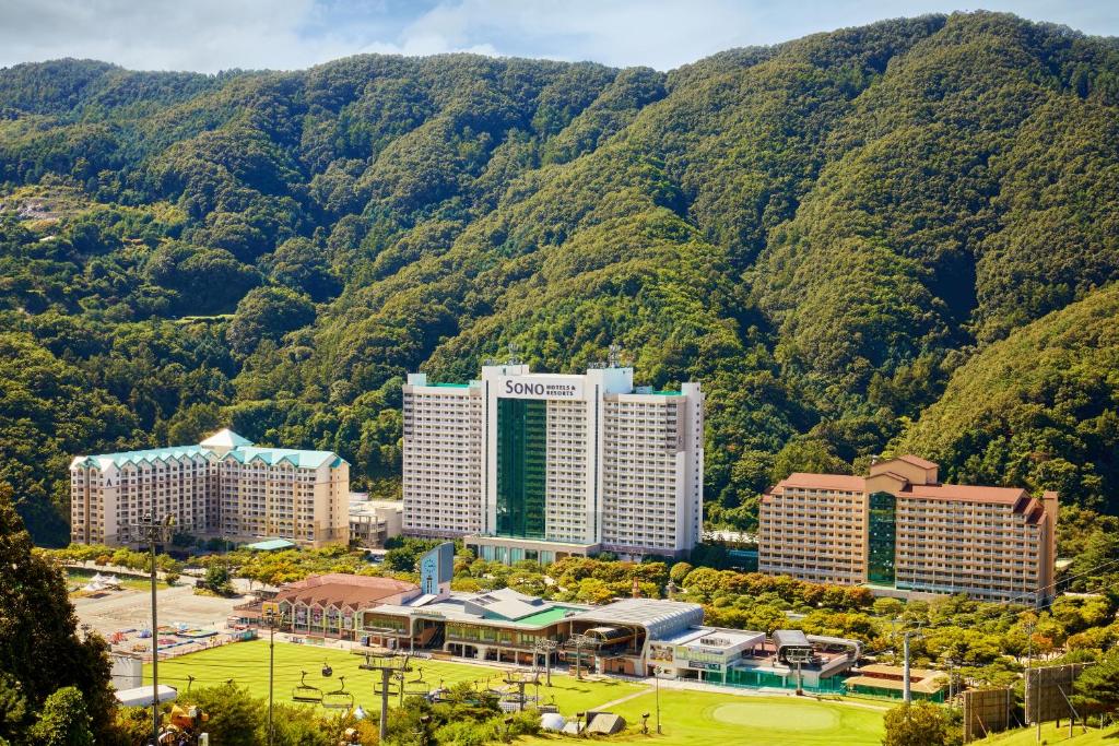 an aerial view of buildings in front of a mountain at Vivaldi Park in Hongcheon