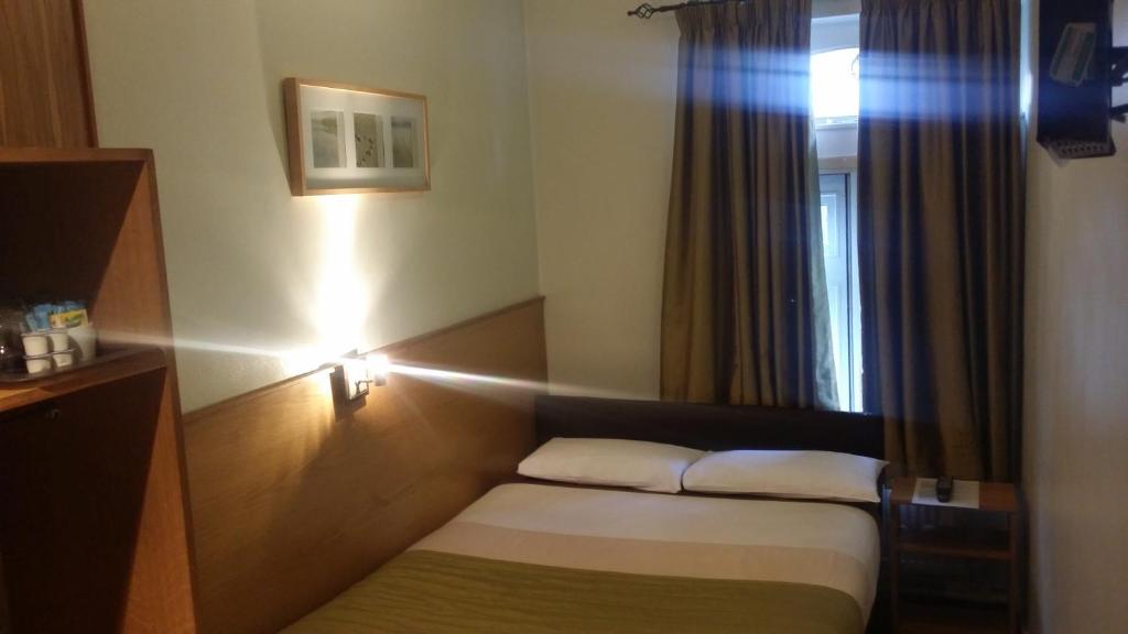 Postel nebo postele na pokoji v ubytování Arriva Hotel