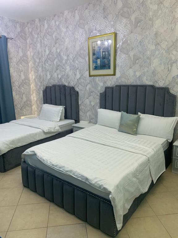 Postel nebo postele na pokoji v ubytování Jin Jie Residence