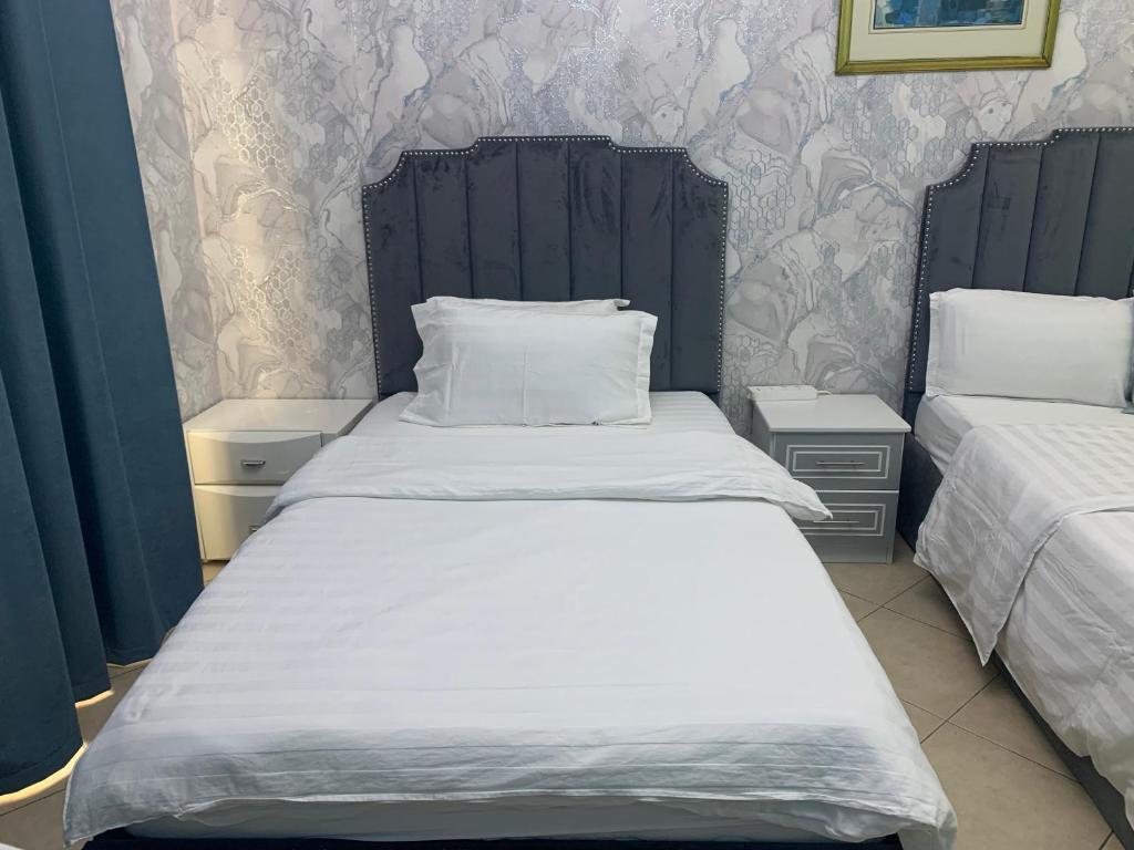 Postel nebo postele na pokoji v ubytování Jin Jie Residence